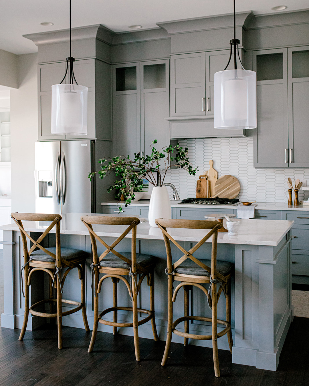 Modern gray kitchen cabinets with island and white countertops